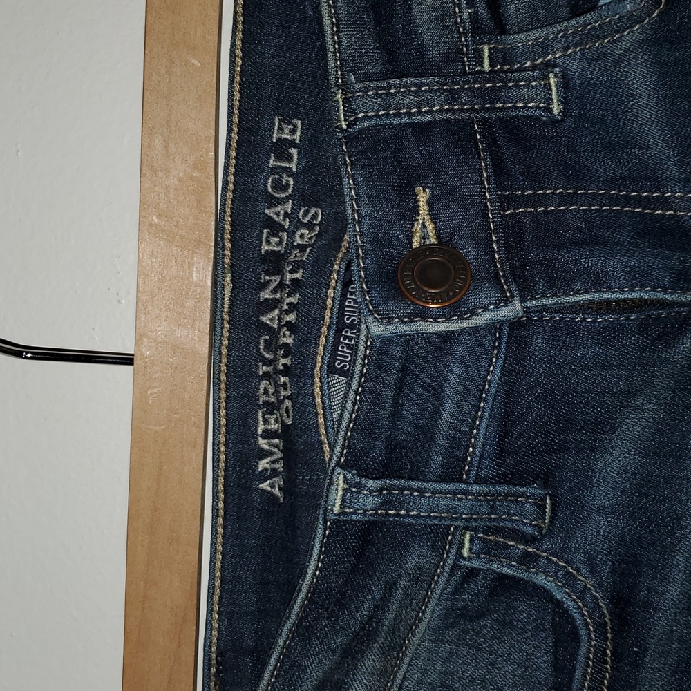 American Eagle Outfitters Women's blue Jeans. Very distressed hems. Size 2 SHORT